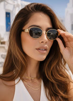 Model wearing Solenne sunglasses in gold — Loulou Eyewear